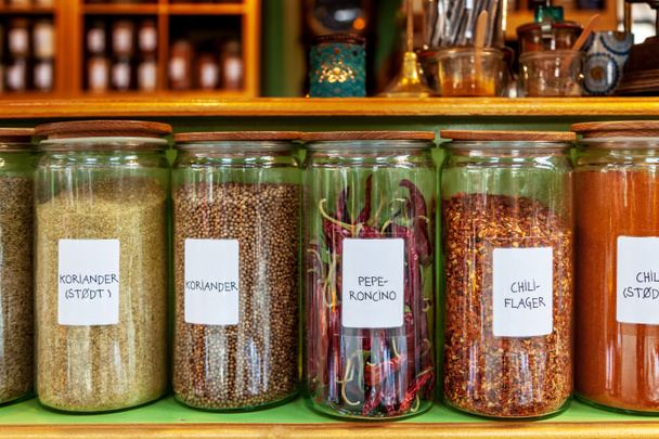 close up image of different spices in jars placed in row - Fotoğraf, Görsel