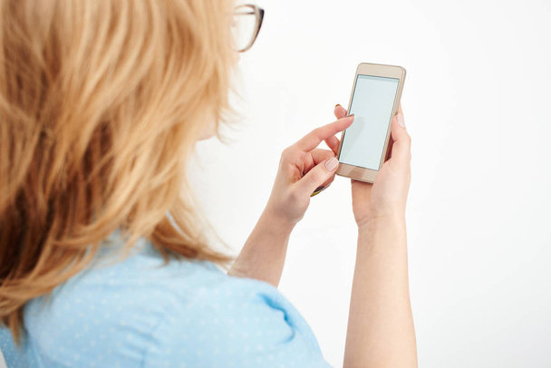 blonde businesswoman using smartphone isolated on white background - Fotografie, Obrázek