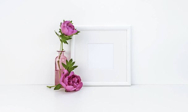 Square frame mockup with peony - Photo, image