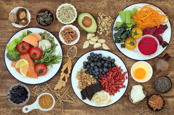 Healthy super food with health promoting properties to sharpen brain power and promote memory with foods high in omega 3, antioxidants, anthocyanins, vitamins and minerals. Top view. - Foto, Imagem