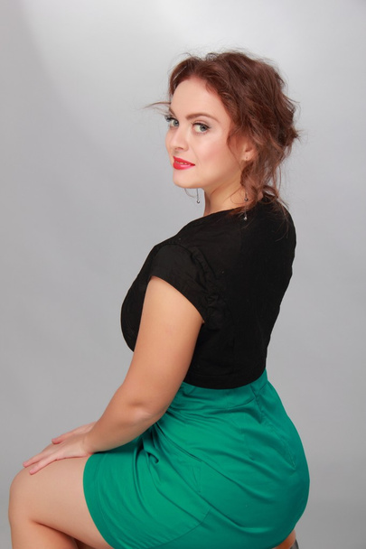 Beautiful woman in a short green dress - Fotografie, Obrázek