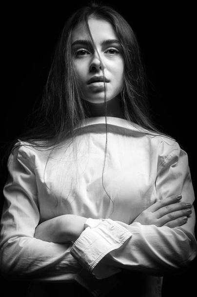 Portrait of a girl in a white shirt - Фото, зображення