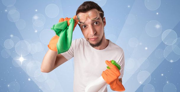 Glittered background with male housekeeper - Foto, imagen