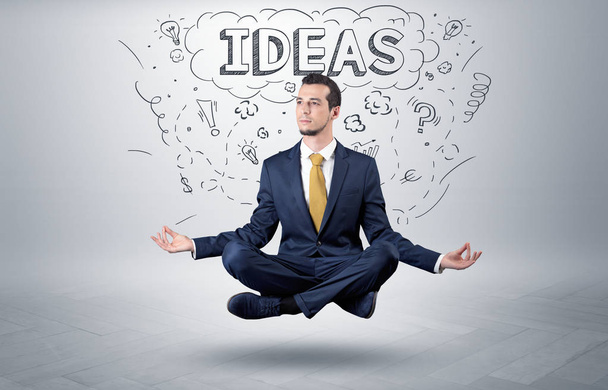 Businessman meditates with doodle concept - Foto, Imagem