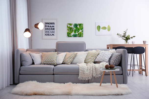 Beautiful room interior with comfortable sofa - Foto, Bild