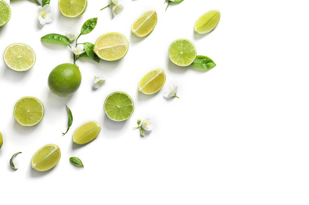 Composition with fresh ripe limes on white background, top view - Photo, Image