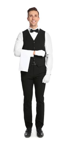 Retrato completo de camarero guapo en elegante uniforme sobre fondo blanco
 - Foto, imagen