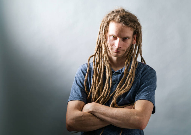 Man with dreadlocks with arms folded - Photo, Image