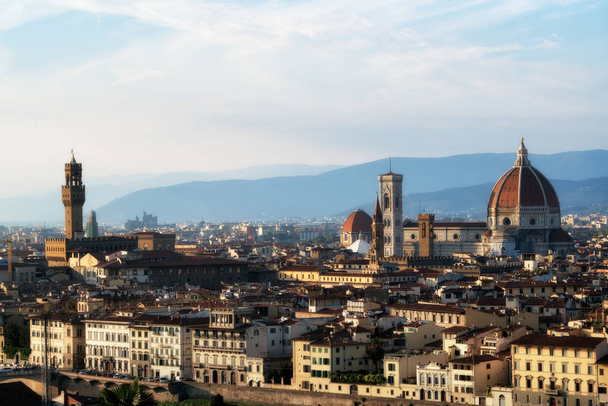 Florence Cathedral (Cattedrale di Santa Maria del Fiore) in historic center of Florence, Italy with panoramic view of the city. Florence Cathedral is the major tourist attraction of Tuscany, Italy. - Photo, Image