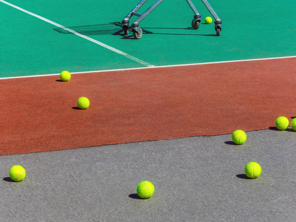 Yellow tennis balls on the tennis field. Big tennis - Photo, Image