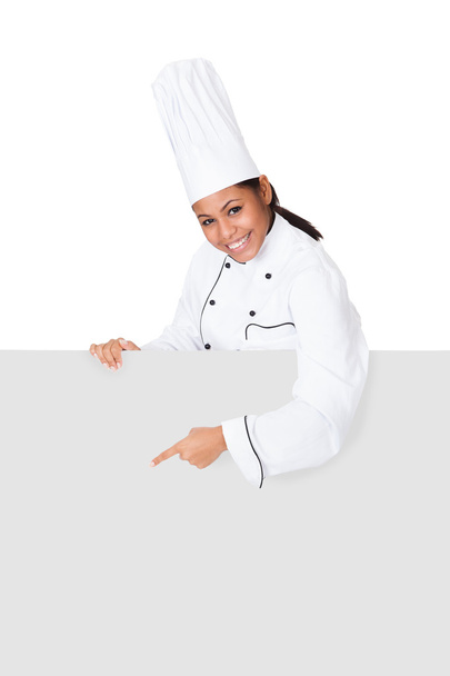 Female Cook Standing Behind The Placard - Foto, Imagen