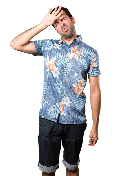 Handsome man with flower shirt with fever on isolated white background - Foto, afbeelding