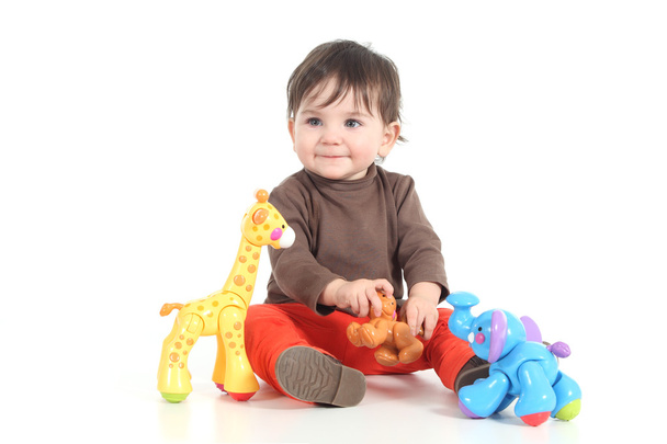 Baby playing with colorful toys - Фото, изображение