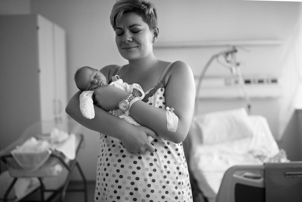 Young mother crying of happiness, childbirth - Fotografie, Obrázek