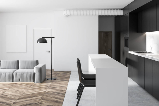 White and black kitchen and living room interior in a studio with a wooden and marble floor, black countertops with built in appliances and a white table with chairs. A couch 3d rendering mock up - Foto, Imagem