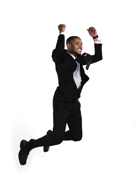 vista lateral de un empresario excitado saltando en el aire
 - Foto, Imagen