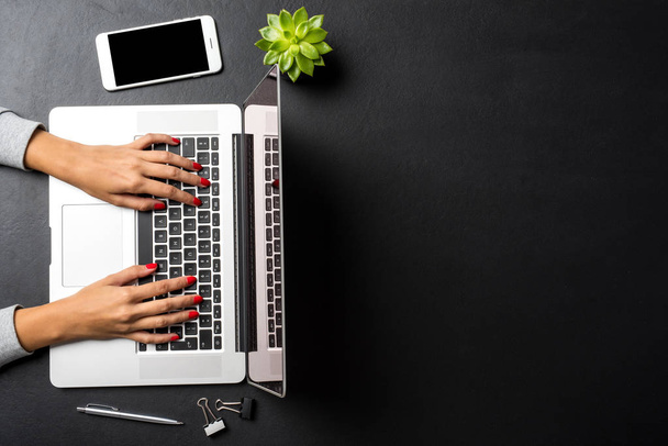 Woman working on laptop. Office background with copyspace. - Fotoğraf, Görsel
