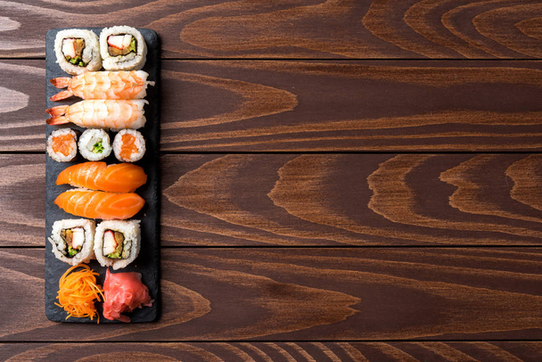 Set of Japanese sushi on wooden background. Close up - Foto, imagen