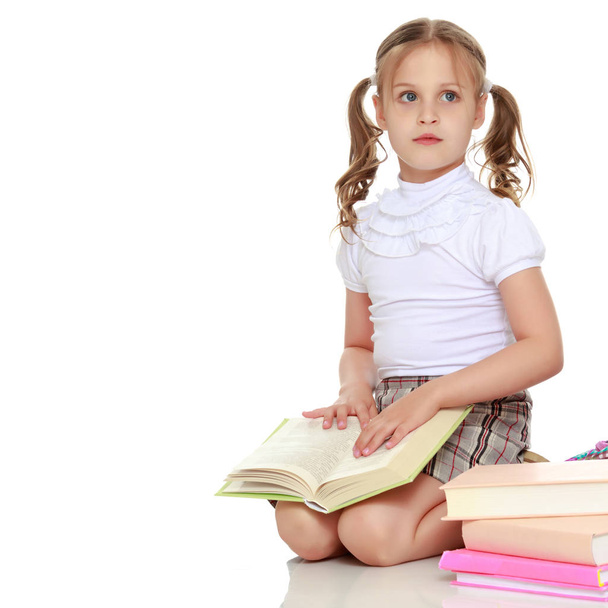 Little girl with a book - Zdjęcie, obraz