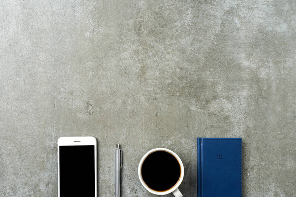Office desktop with pen, smart phone and notebook - Zdjęcie, obraz