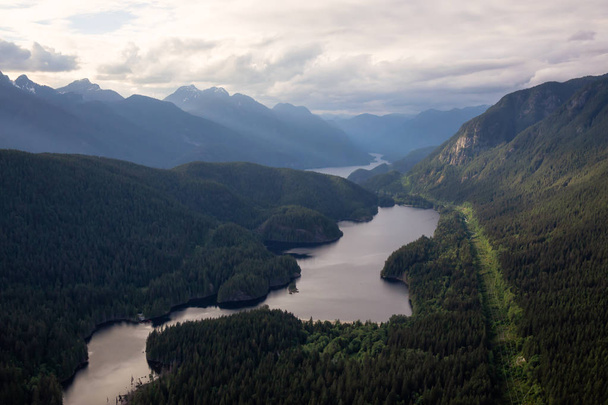 Aerial view of Buntzen Lake during a cloudy evening. Taken in Vancouver, British Columbia, Canada. - Foto, Bild