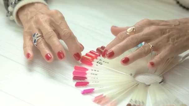 Female manicured hands and nail samples. - Footage, Video