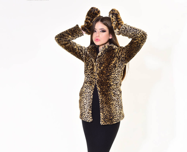Woman in leopard fur coat isolated on white. pretty woman in mittens for winter season. - Фото, изображение