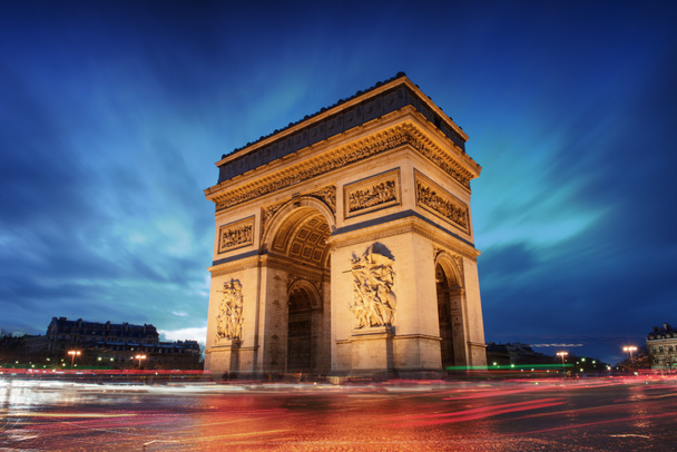 Arc de triomphe paris stad bij zonsondergang - Foto, afbeelding