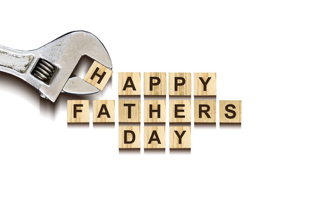 Happy Fathers Day inscription on wooden cubes with working tools on white background, isolated. Happy Fathers Day Concept. Greetings and gifts.Holidays. - Photo, Image