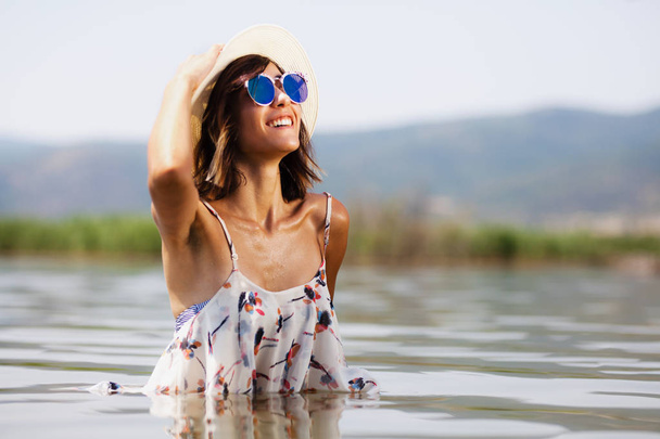 sexy girl with a shirt posing in water - Φωτογραφία, εικόνα