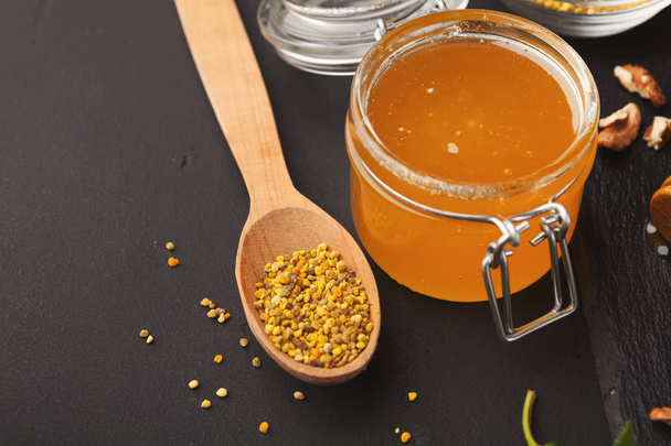 Jar of honey on wooden background - Photo, Image
