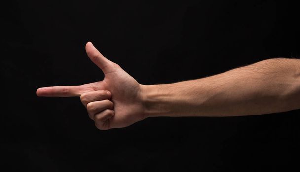 Hand gestures - man pointing, isolated at black - Photo, Image