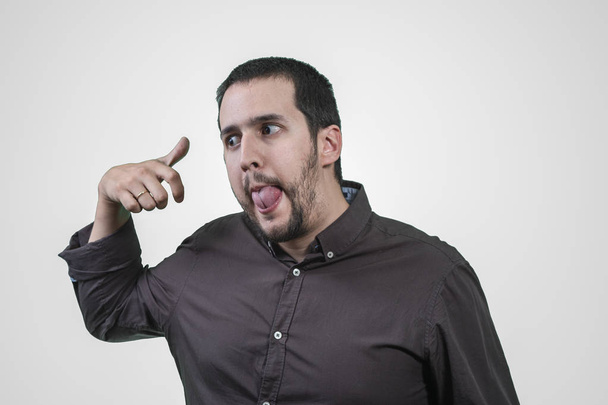 man with aggressive expression on white background - Photo, Image