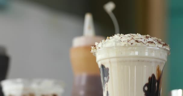 Delicious milkshake on table - Footage, Video
