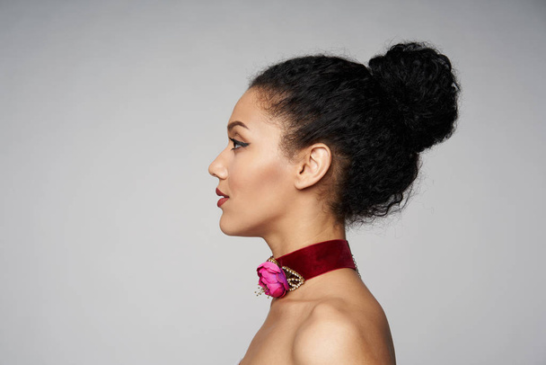 Beauty profile portrait of beautiful mixed race woman wearing chocker - Fotó, kép