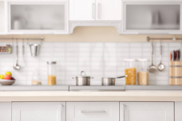 Countertop and blurred view of kitchen interior on background - Foto, imagen