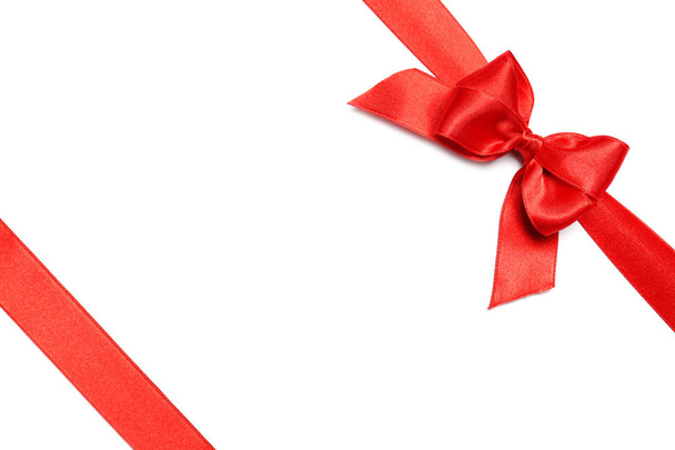 Red ribbons with bow on white background, top view - Foto, Imagen