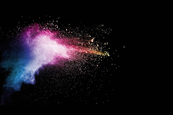 Explosion of multicolored dust on black background. - Foto, Bild