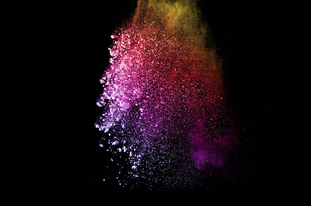 Explosion of multicolored dust on black background. - Photo, Image