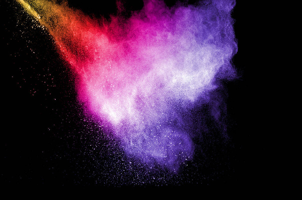 Explosion of multicolored dust on black background. - Photo, Image