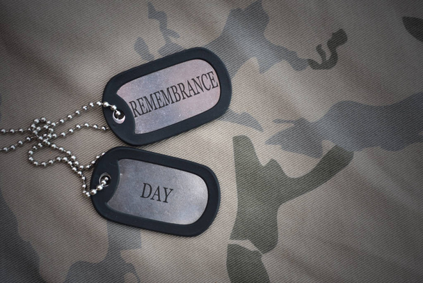army blank, dog tag with text remembrance day on the khaki texture background. military concept - Photo, Image