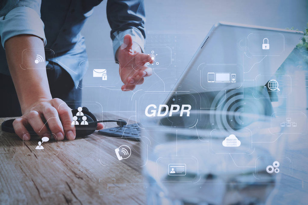 GDPR. Data Protection Regulation with Cyber security and privacy virtual diagram.Man using VOIP headset with digital tablet computer docking smart keyboard, concept communication, it support. - Foto, afbeelding