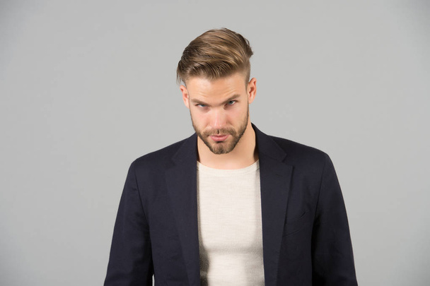 Guy bearded attractive well groomed businessman. Businessman bearded strict calm face manager, grey background. Man with beard unshaven guy looks handsome well groomed formal wear. Fashion concept - Foto, imagen