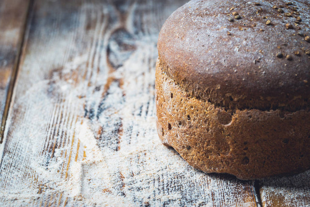 freshly baked bread on dark gray kitchen table - Foto, immagini