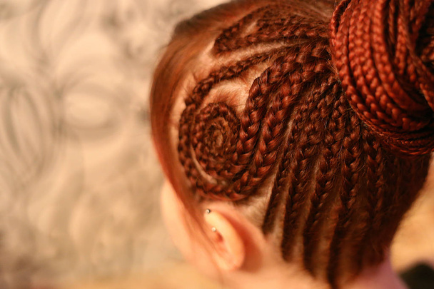 background of African braids, background for text, close-up of plaits, youth hairdressers hairdressers, master's work, plaiting braids - Photo, Image