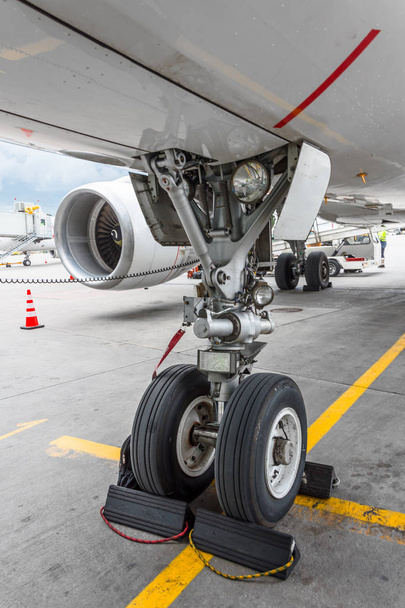 Front landing gear of big passenger aircraft closeup high detailed view - Photo, Image