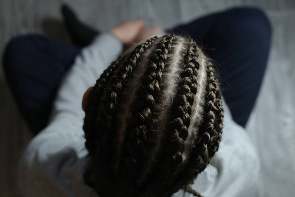 cornrows, an African hairstyle made of thin plaits on the head of a man. Men's braids - Photo, Image