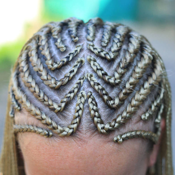 Close-up of hair braided in pigtails, girl's head, blonde hair,  - Photo, Image