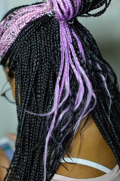 African braids from kanekalon on a girl, black with pink highlig - Photo, Image
