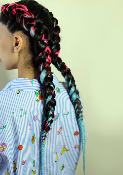 Girl with two braids blue and pink amber, fashionable youth hair - Photo, Image